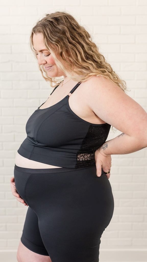 Postpartum starter bundle in black on maternity model, amelia pumping and nursing crop cami, mia postpartum boxers, Paisley reusable nursing pad liner